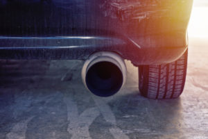 Close up view of modern car powerful exhaust pipe with sun light